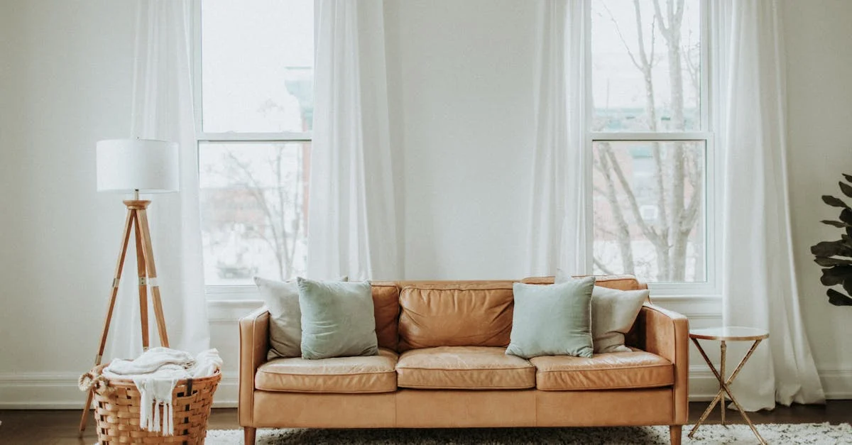 a couch with pillows in front of a window