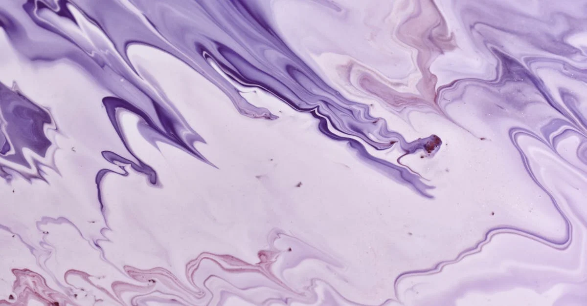 a close up of a purple and white liquid