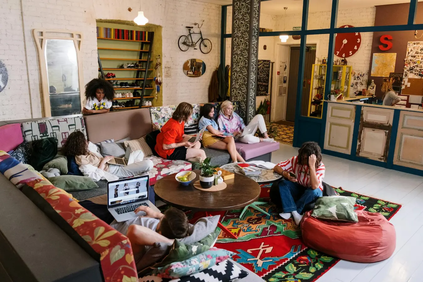 a group of people sitting in Common & Communal Areas